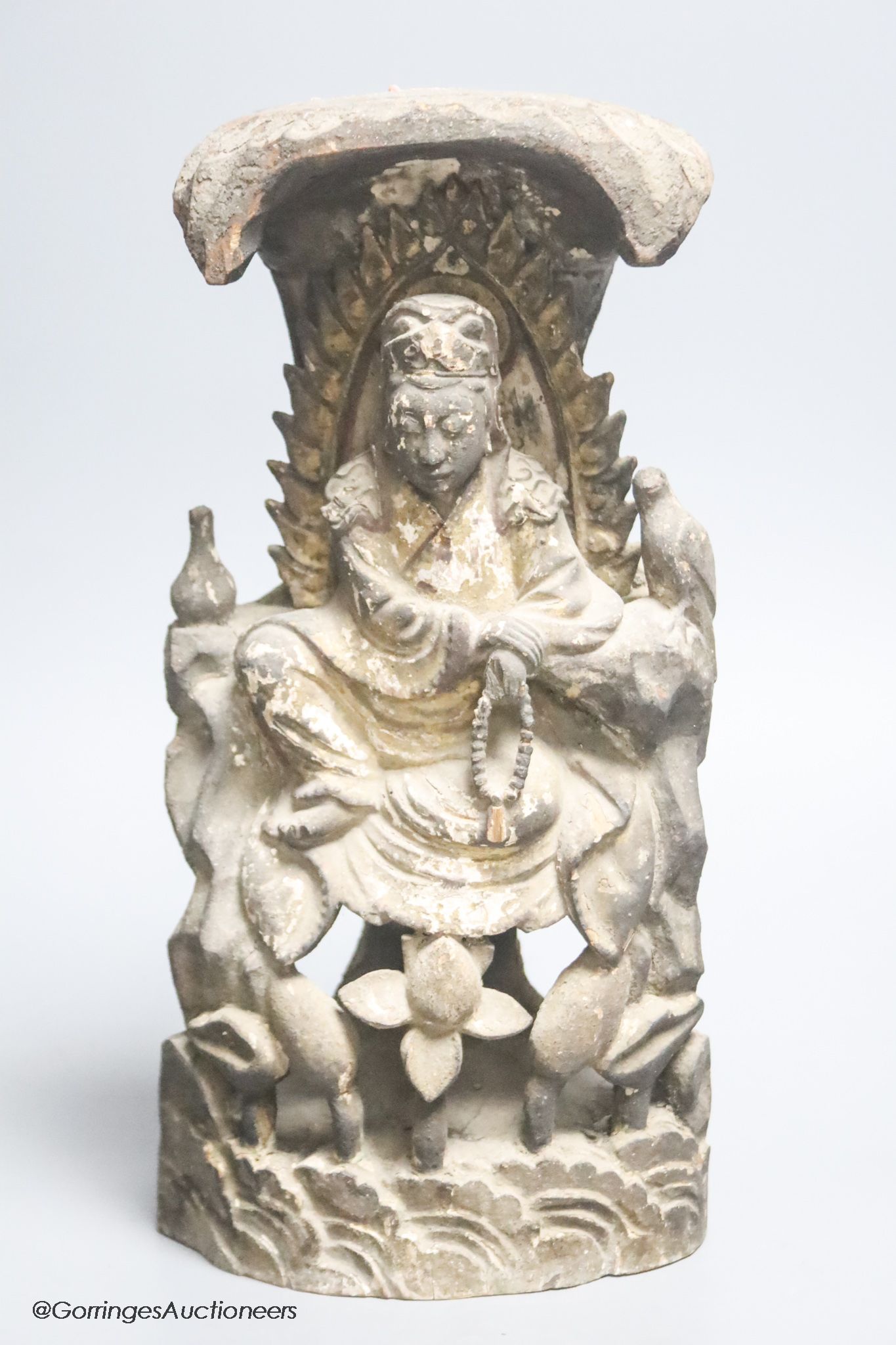 A Chinese lacquered wood seated figure of Guanyin, height 29cm